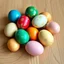 Placeholder: 8k resolution, 16:9 aspect ratio photograph, photorealistic style reminiscent of Dutch Golden Age still life paintings. A meticulously arranged cluster of twelve Easter eggs, flawlessly smooth and glossy, rests on a rustic light oak surface, its fine grain texture subtly visible. The eggs, exhibiting a vibrant palette of azure, emerald, ruby, golden yellow, and blush pink, reflect soft, diffused natural light. Intricate patterns—delicate floral motifs and abstract swirls in gold leaf accents—ad
