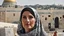 Placeholder: A woman wearing a keffiyeh holds the Dome of the Rock