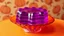 Placeholder: 1950's photo-realistic kitschy layered gelatin in an orange crystal dish sitting on a retro table. the background is faded kitschy pumpkin wallpaper. the gelatin is see-through deep purple. the table has no pattern on it. this gelatin is molded extravagantly. there is glitter inside of the gelatin