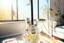 Placeholder: A lovely clear transparent resin guitar with wildflower design in a modern room in sunshine