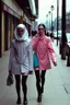 Placeholder: women walking down a central street of a city wearing second-hand clothes #eslarevolucióndelassecondhand, modern pop style, real photography, fashion, de cara a la cámara