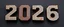 Placeholder: "2026" in squared block letters made of shiny and rusty metal on contrasting background