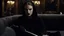 Placeholder: [Legend (1985)] Natalie Portman as Dahlia Death, she is a pale brunette with black lipstick clad in a dark agent provocateur dress with a hoodie and a scythe. She sits on a sofa in a dark mansion