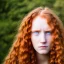 Placeholder: face of a young woman head and gaze downcast with fine features and long ginger hair