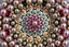 Placeholder: 3d Kaleidoscope recursive made of a metallic random color pearl spheres,hexagon diamonds, turning many times likr Spirograph drawing Kaleidoscope Ruler Set creation