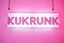 Placeholder: A 1980 disco sign labeled "KUKRUNK" white background and bold 80s font