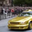 Placeholder: Donald Trump Driving a Gold Car