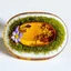 Placeholder: flowers and moss in an oval piece of amber white bg