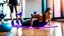 Placeholder: woman dirties floor in workout room