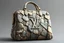 Placeholder: "Create a hyper-realistic image of a Louis Vuitton handbag with an exterior crafted entirely from jagged stone and rock fragments. The body of the bag is made up of various rough-textured stones and sharp-edged rock pieces, carefully assembled to form the iconic Louis Vuitton shape. Each stone is distinct, with natural cracks, crevices, and color variations, creating a rugged and organic appearance. The iconic Louis Vuitton monogram is subtly integrated into the stone surface, carved into the ro