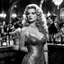 Placeholder: [shot from the movie The Untouchables 1920] Barbarella with her signature sultry appearance is The Dark Lord's Granddaughter: in a bar during prohibition with her bloody fangs, a lace dress , she shops for blood in a dark, ominous curiosity shop filled with bottles of whiskey, in the background people are playing cards with a vintage 1921 Thompson submachine gun with a 100-round drum magazine in her hand
