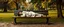 Placeholder: master oil painting by Rembrandt, flat paper person sleeping on a bench in the park