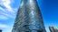 Placeholder: Majestic tower clad in steel and glass scales, embodying the essence of biomimetic architecture. Its shimmering surface transforms throughout the day, presenting an ever-changing appearance.