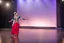 Placeholder: azeri female full bdy with traditional dance clothing in modern stage in a royal hall