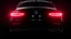 Placeholder: Full view of the rear view of a black Mercedes-Benz CLS 550 with bright neon lights on a black background
