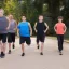 Placeholder: Boys, young men, an older man doing resistance exercise together