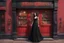 Placeholder: Photorealistic image of a slender, young woman with dark hair, in a witchy, black dress, no hat, leaning back against a shop door with red-painted, large, multi-paned windows on either side of a red-painted multi-paned door. Walls made of brick. The shop is selling magic gifts and trinkets. Large sign over the door.