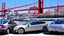 Placeholder: A Tesla's 'Model S Plaid' is parked, over the 'Pier 39', in San Francisco. CINEMATIC. WIDE ANGLE LENS.