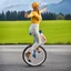 Placeholder: lady driving a Unicycle Wheel Bike