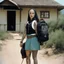Placeholder: (high res photo by Russ Meyer) Clara, the tattooed free spirit, gangsta nun, burdened with two backpacks, one on her back and one on her front. Is she moving from one house to another or embarking on a vacation to camp? Difficult to say. The constant pressure to keep those worlds coming. The weirder, the better. The weight of the backpacks, the burdens she carries, both physically and metaphorically. Clara seeks solace in the freedom of movement.
