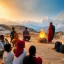 Placeholder: mystical indian guru teaching his group of disciple in adoration in himalaya, atround a fire at sunset