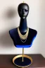 Placeholder: dark blue velvet Necklace Mannequin Stand on a luxury table