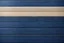 Placeholder: some sand over Navy Blue wooden planks Background