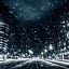 Placeholder: City at night with dark clouds and falling snow