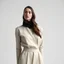 Placeholder: A minimalist female fashion model.