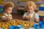 Placeholder: a curly-haired blond boy counts money and stacks gold coins in a modern nursery, in sunshine