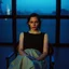 Placeholder: Actress Mia Goth in a chair,, blue hour