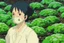 Placeholder: A young woman, Yui, is seen inside one of the biodomes tending to a variety of plant life. Her eyes reflect determination and spirit. She wears a respirator around her neck,