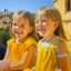 Placeholder: Neoclassicism child smiling at other child painting yellow realistic cote d'azur