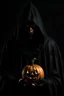 Placeholder: a man wearing a black cloak and his head is a lit jack o' lantern