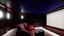 Placeholder: Generate an image of a sleek home cinema with our top-notch projectors and surround sound systems with a star-lined ceiling similar to a Rolls Royce in a high-rise penthouse