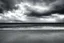 Placeholder: Surrealistic seashore, stormy clouds,