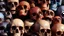 Placeholder: a picture of a dark, comedic, anatomically correct wall of colorful tightly packed stacked skulls of varying sizes and expressions, photo realistic, insanely meticulous, highly detailed, part of a collection of bones on display, 64k, dystopian, vray