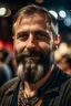 Placeholder: nice looking middelaged man with short beard attending a heavy metal concert