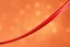 Placeholder: Minimalist abstract art of sweeping red silk-like ribbons with a metallic sheen. The diagonal composition is complemented by a background of ethereal golden bokeh. Soft ambient lighting emphasizes the smooth, polished curves and vibrant red tones. Sophisticated mood with a clean, high-end digital art style.