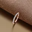 Placeholder: delicate thin ring with diamond dust, knot, rose gold, thin ring