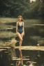 Placeholder: [vintage] A woman in swimsuit around a pond