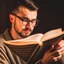 Placeholder: A picture of a person reading a remarkable book on self-development, with a focus on working on self-improvement and acquiring new knowledge.