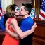 Placeholder: NANCY PELOSI, KISSING Volodymyr Zelensky WITH A BEARD wearing TANKTOP,