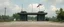 Placeholder: a realistic old style military checkpoint in front of utopia green world