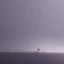 Placeholder: battlecruiser coming out of a fog bank