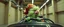 Placeholder: car driving happy 2d fluffy pirate parrot troll in the style of Escher and Giger and Fallout 4, pinhole cam, airbrush 3d rendering, on tv screen:A five-second cinematic single take in a clean industrial presentation hall.