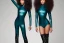 Placeholder: A youthful dreamer with brown skin once flawless, scarred around her hands and a long scar across her left eye. With long curly black hair that flows down her back and cascades over her shoulders. She stands 5 inches taller wearing teal thigh high boots, wearing a matching teal leather skintight catsuit. Around her waist a simple berry colored sash, around her shoulders, a black shawl.