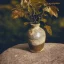 Placeholder: artistic photo of a tiny cracked ceramic vase repaired with gold, kintsugi, garden setting, beautiful landscape photography, beautiful, vines and leaves, delicate, cinematic, high detail, beautiful composition, delicate arrangement, aesthetic, soft lighting, award winning photography, tender