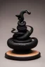 Placeholder: an ominous small statuette made of ebony in the form of a mountain encircled by a snake