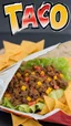 Placeholder: "Taco in a Bag" which consists of an open Doritos chip bag with sides rolled down, containing Doritos chips and cooked ground beef and lettuce and shredded cheese and chopped tomato pepper and onions and topped with more nacho chips, food blogger photography